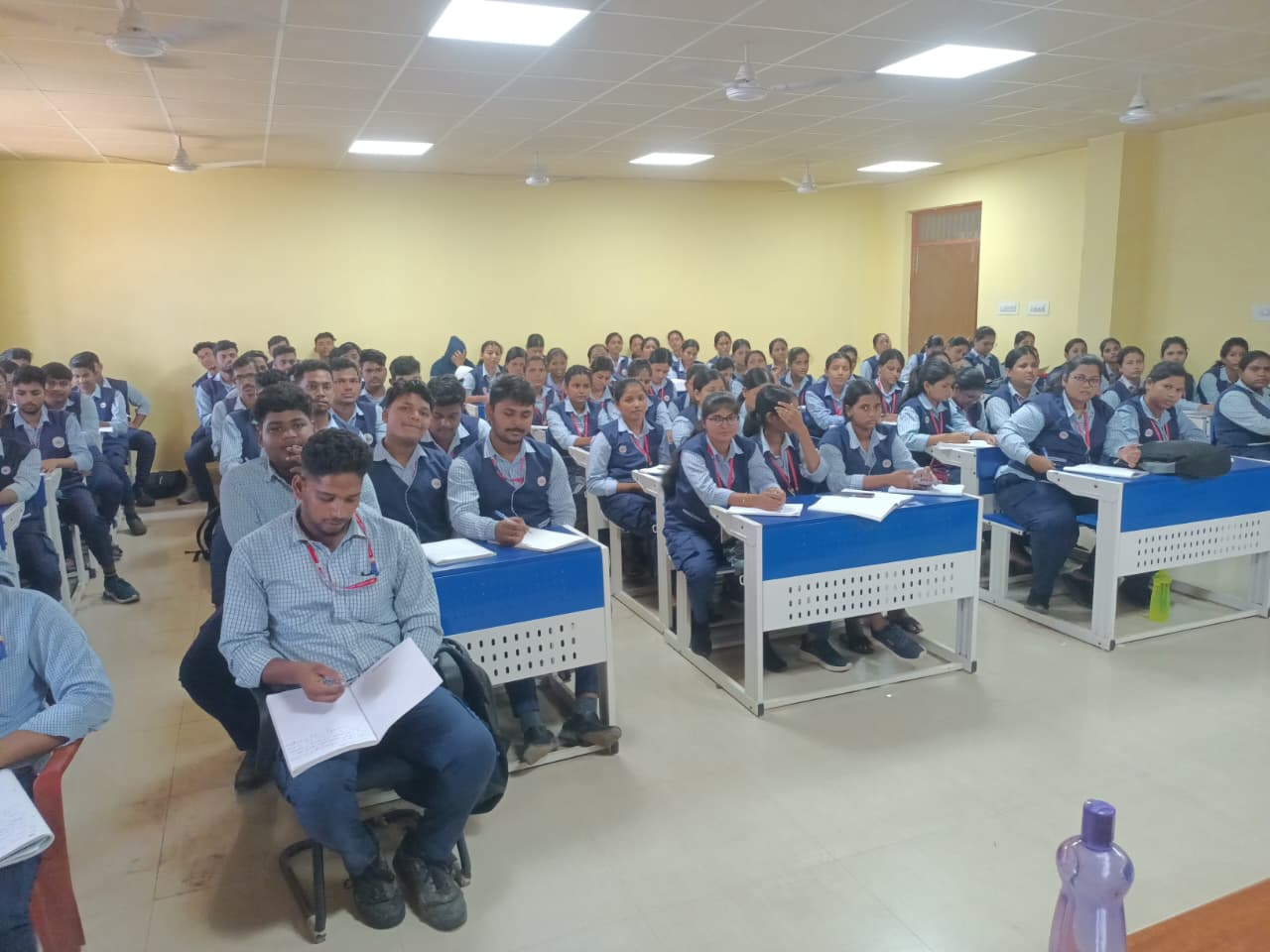 Students taking notes during a training session